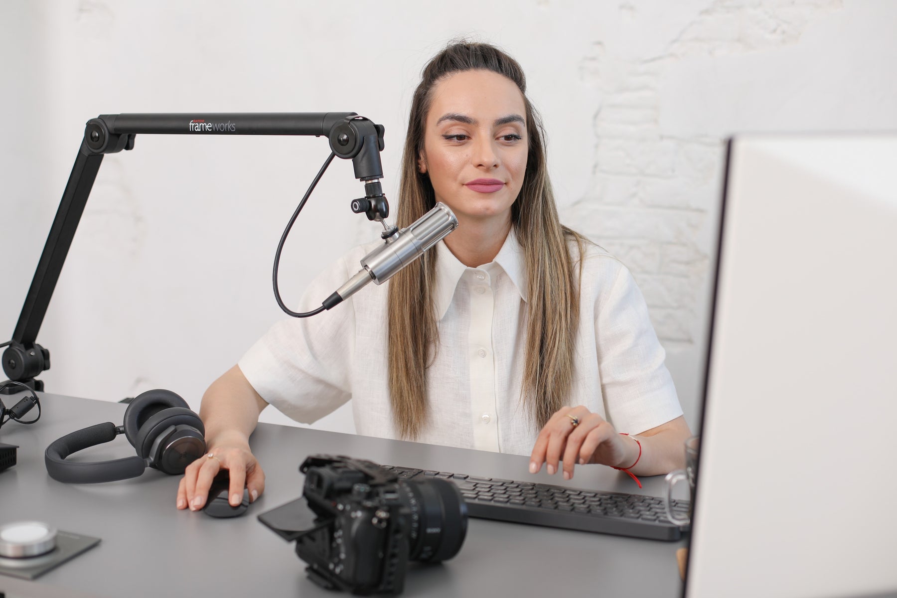 Female Content Creator Preparing To Caption YouTube Video In YouTube Studio